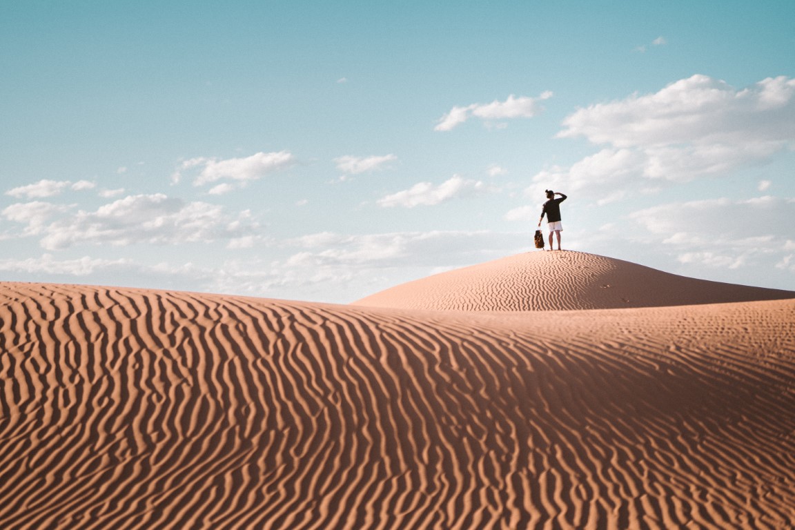 person-standing-on-brown-sand-under-blue-sky-4405252